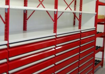 red and white shelving with drawers