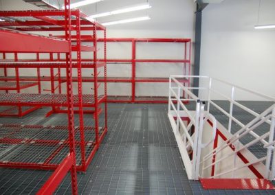 mezzanine with shelving and stairs